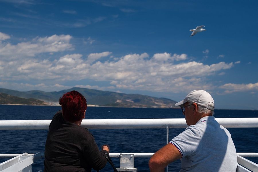 Senior couple enjoying a sea view from the deck